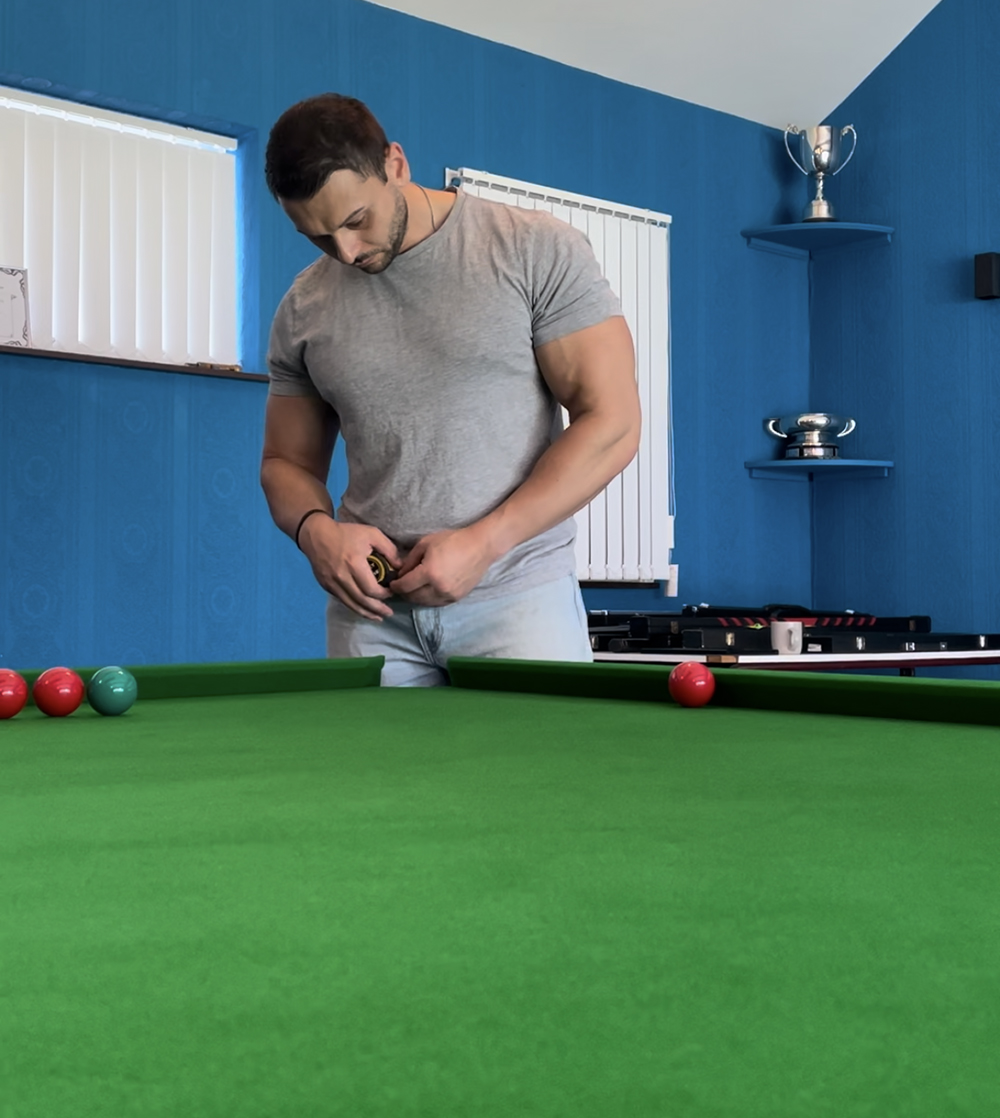 man standing next to snooker table 2